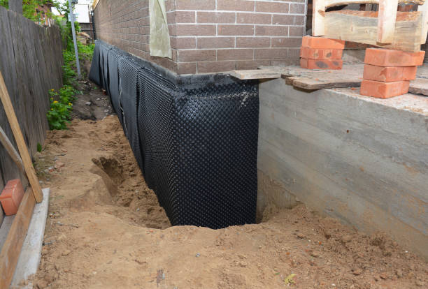 Happy homeowners after waterproofing job in Francesville